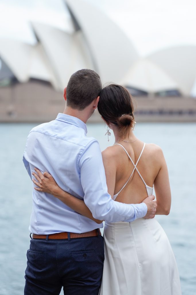 Married couple looking over at the Sydney Opera House