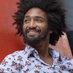 Ext: Young black man having a dating app photo taken by dating photographer Georgie Greene in Sydney NSW