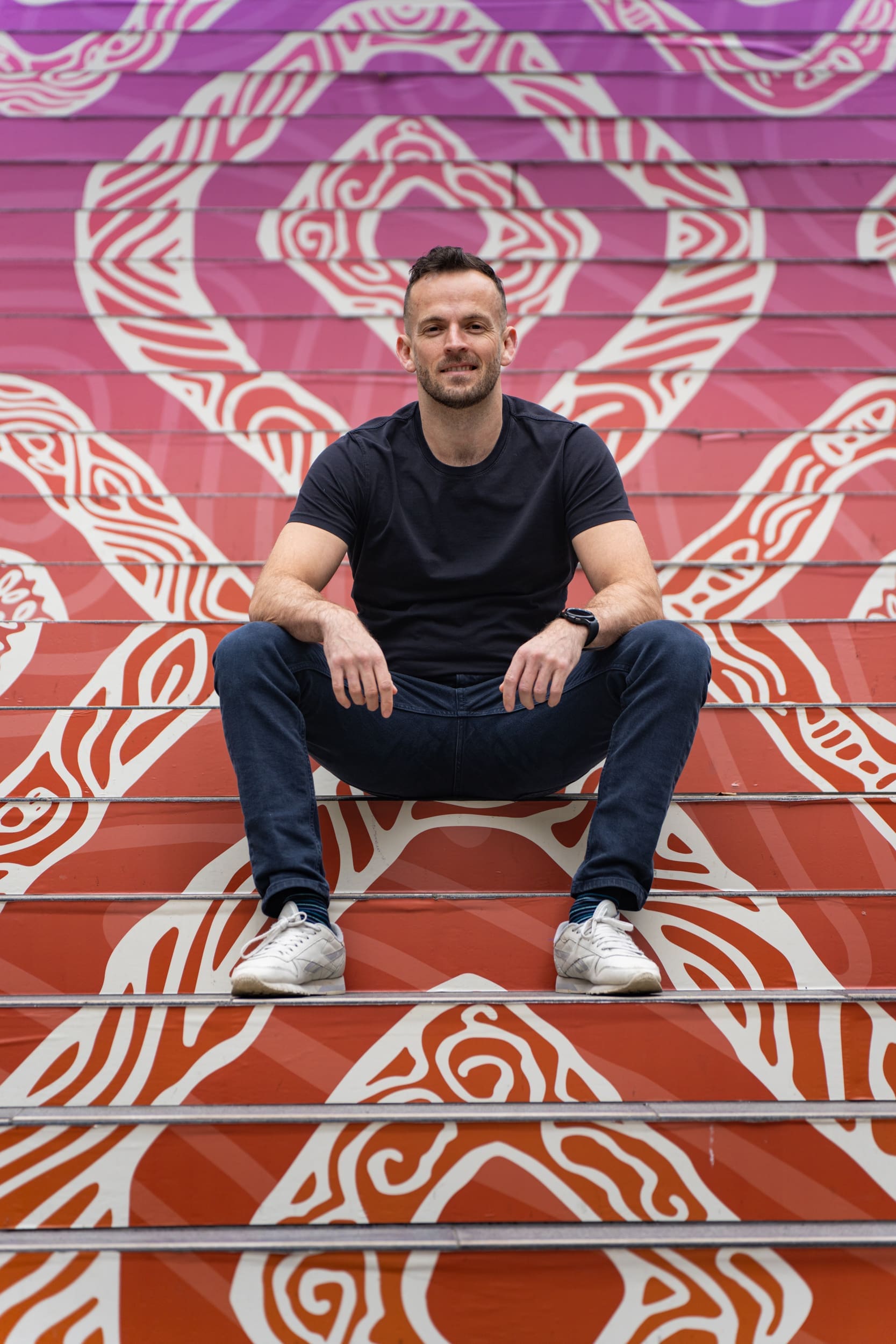 Ext: Young man wearing black having his dating photography taken by online dating photographer Georgie Greene in Sydney NSW
