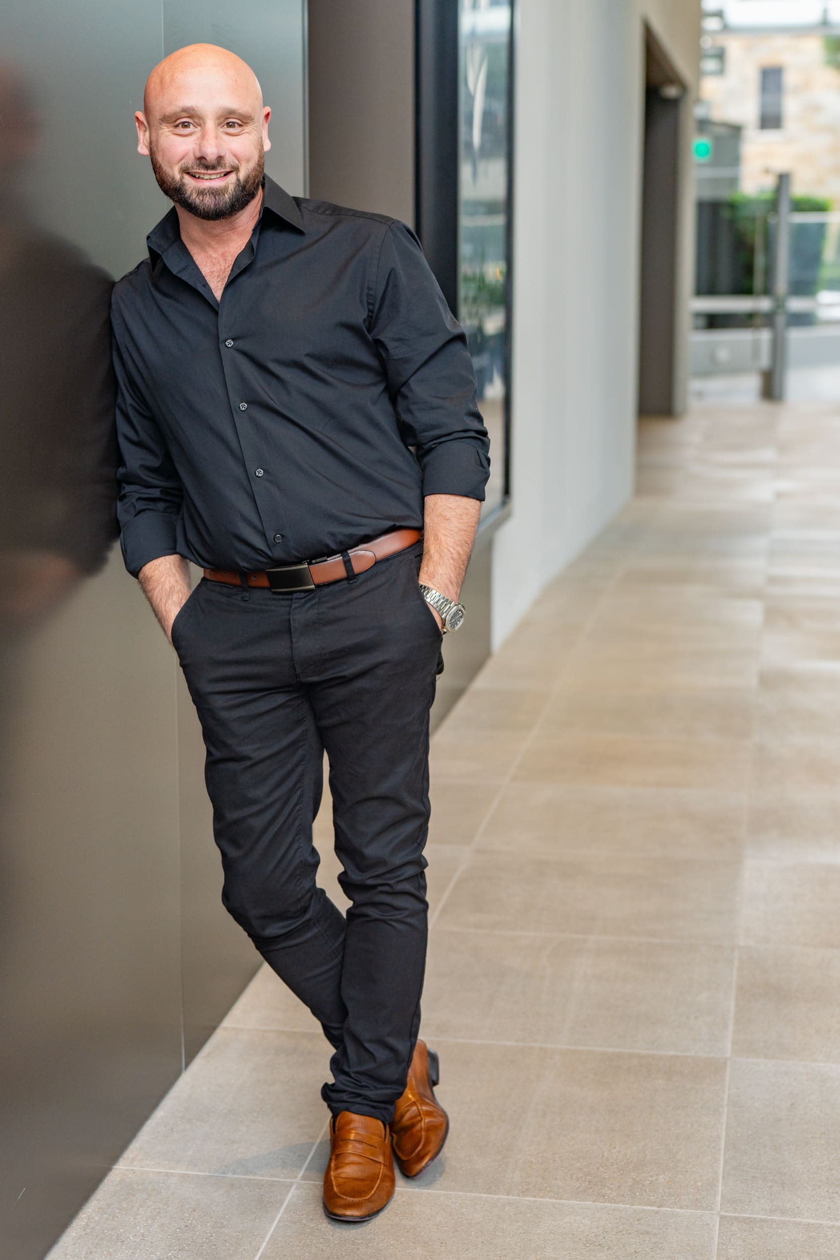 Int: Entrepreneur wearing a black shirt having portrait shots taken by personal branding photographer Georgie Greene in Sydney NSW