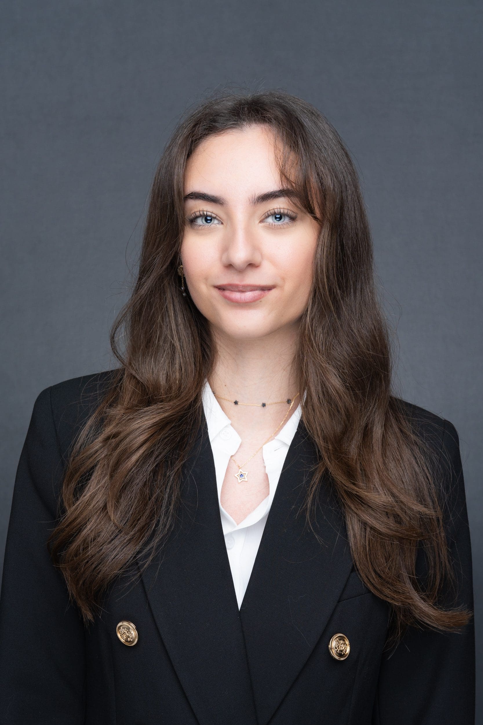 Int: Young woman in a blue jacket having an Executive headshot taken by Sydney Headshot Photographer Georgie Greene in Sydney NSW