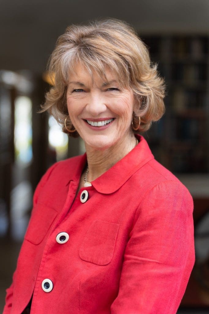 Ext: Geraldine Doogue in a red top having her Sydney headshots taken by professional photographer Georgie Greene in Sydney NSW
