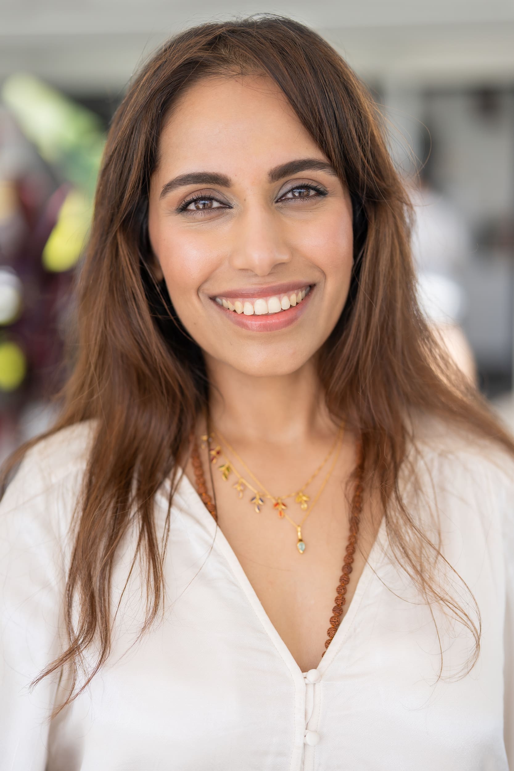 Ext: Holistic Brand Strategist wearing a cream top having her headshot taken by professional photographer Georgie Greene in Sydney NSW
