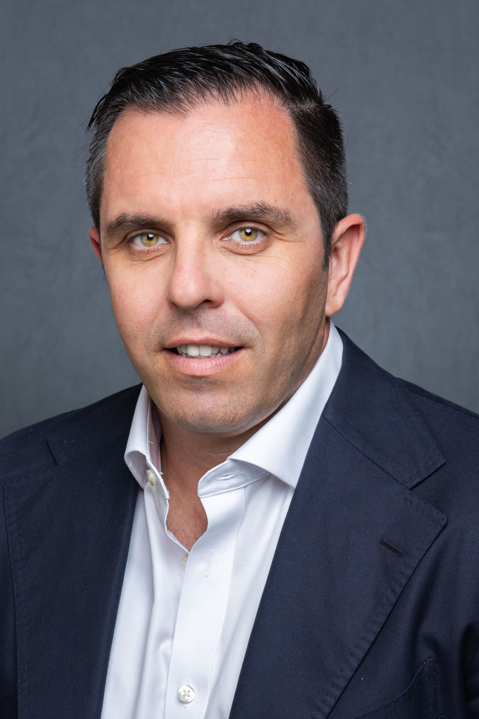 Int: man with dark hair in a suit having a head shot taken by Sydney Headshot Photographer Georgie Greene in Sydney NSW