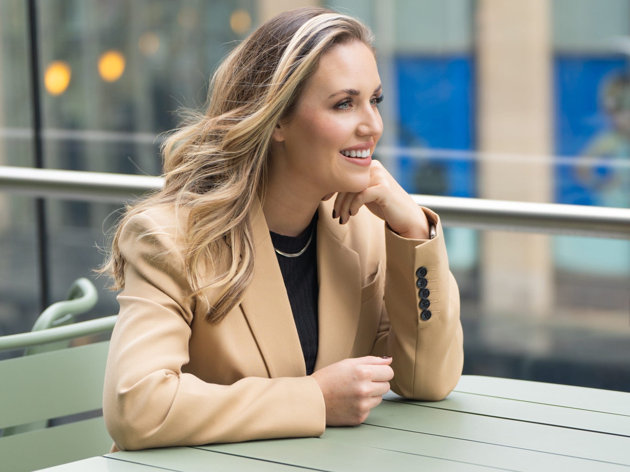 Ext: Managing director wearing a fawn suite having her personal branding photography taken by Georgie Greene in Sydney NSW