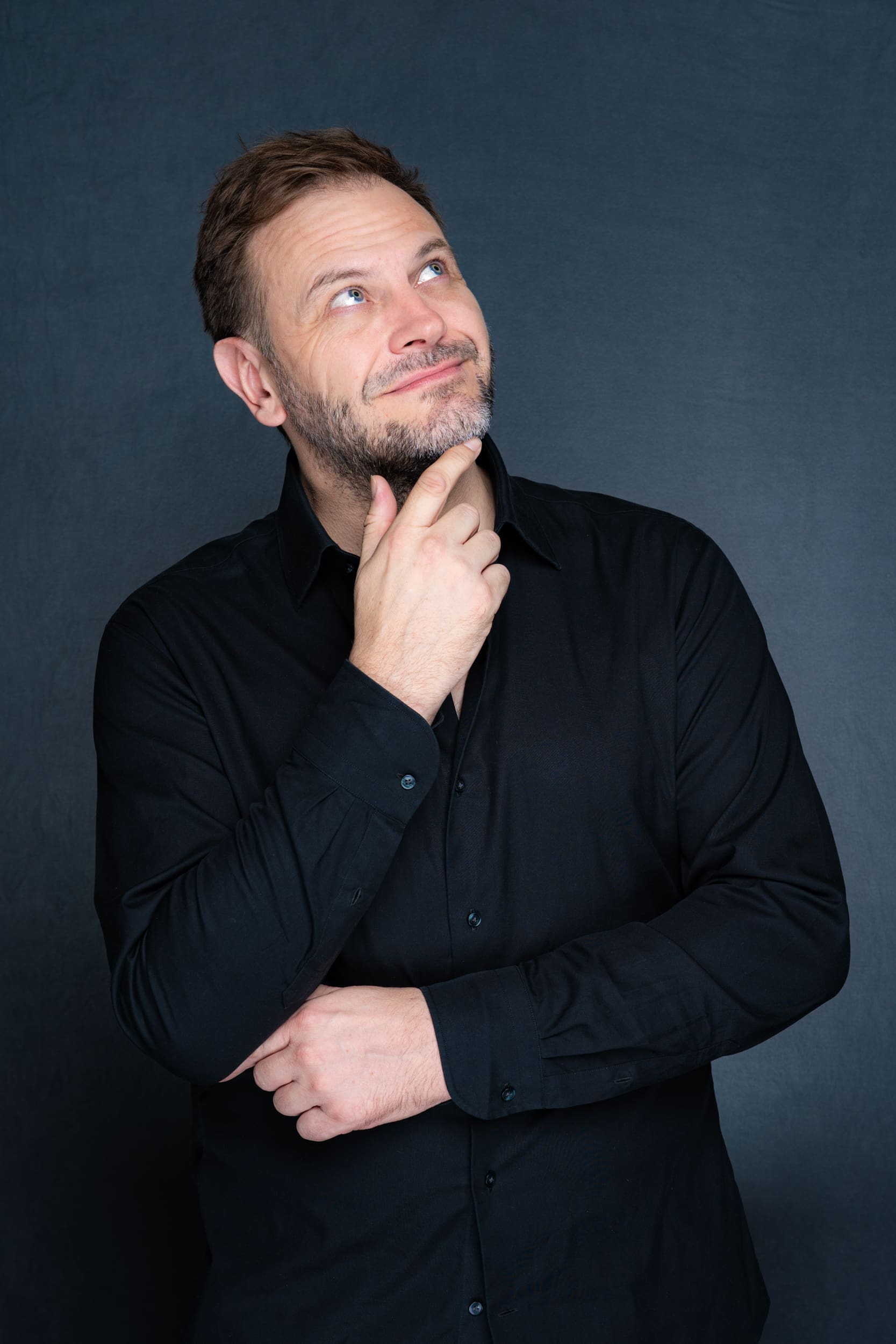 Int: Stand-up Comedic in a black shirt against a grey backdrop Personal Branding Portraits Sydney NSW