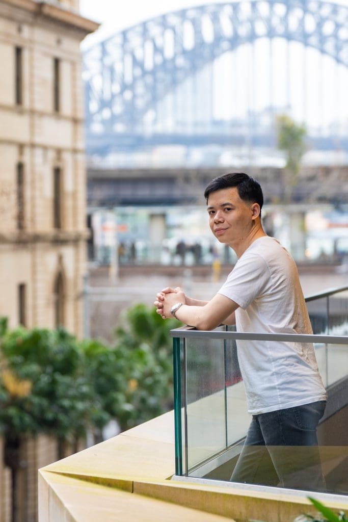 Ext: Young Asian man wearing a white shirt having Sydney dating profile photos taken by online dating photographer Georgie Greene in Sydney NSW