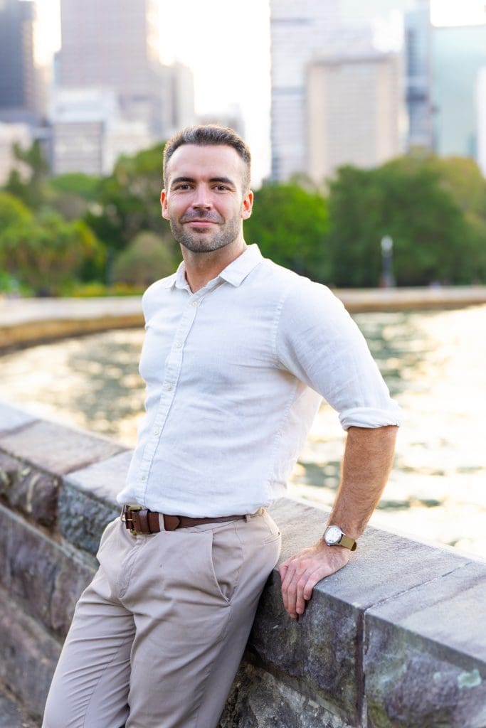 Ext: Young man wearing white having a dating app photo taken by Sydney dating photographer Georgie Greene in Sydney NSW