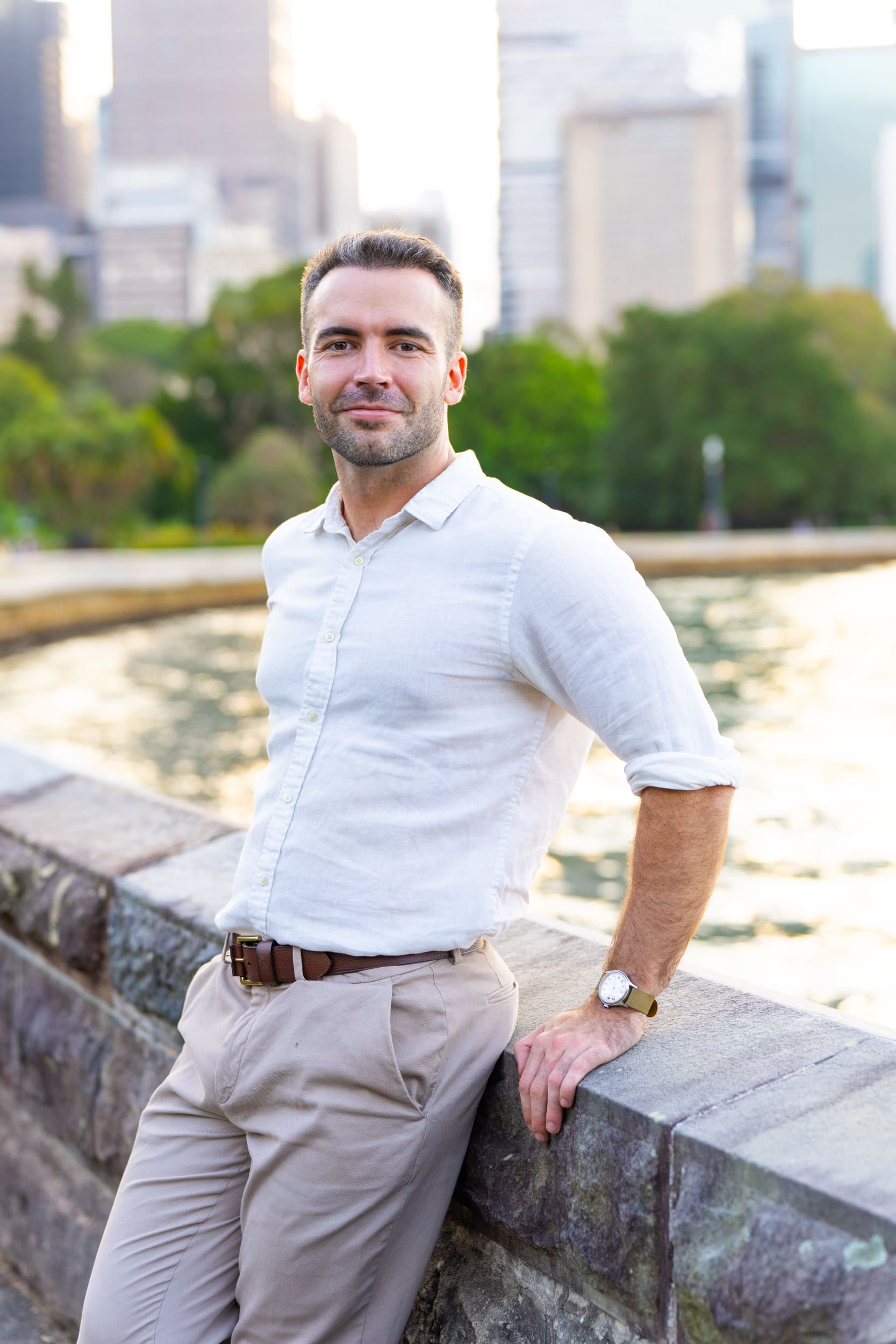 Ext: Young man wearing white having a dating app photo taken by dating photographer Georgie Greene in Sydney NSW