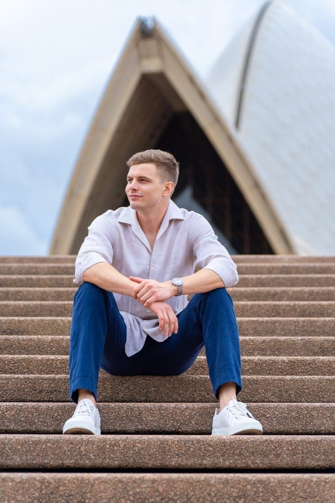 Ext: Young man wearing cream shirt having a dating app photo taken by dating photographer Georgie Greene in Sydney NSW