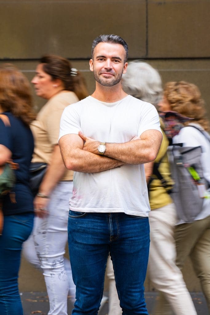 Ext: Young man wearing white having his professional dating photos taken with professional photographer Georgie Greene in Sydney NSW