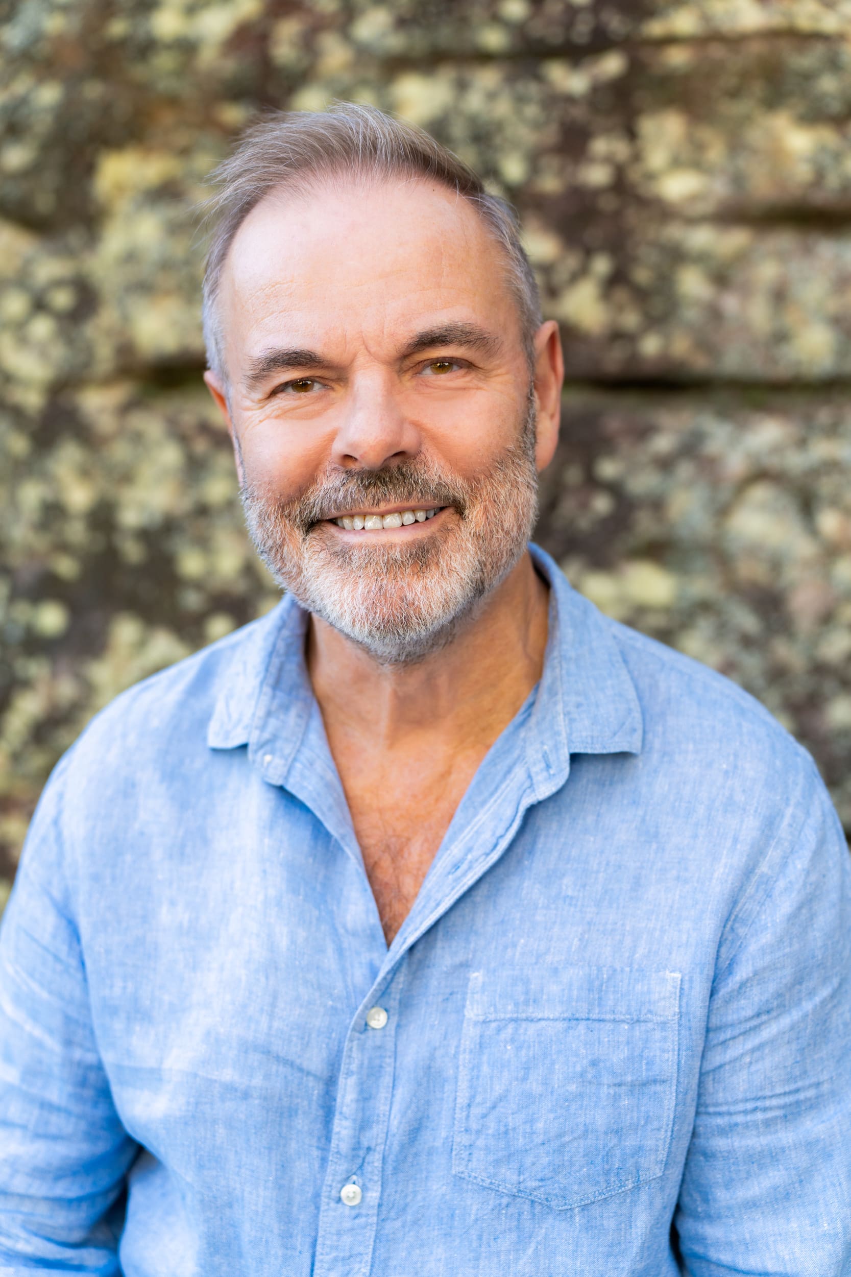 Ext: Journalist wearing a grey shirt having his branding photos taken by portrait photographer Georgie Greene in Sydney NSW