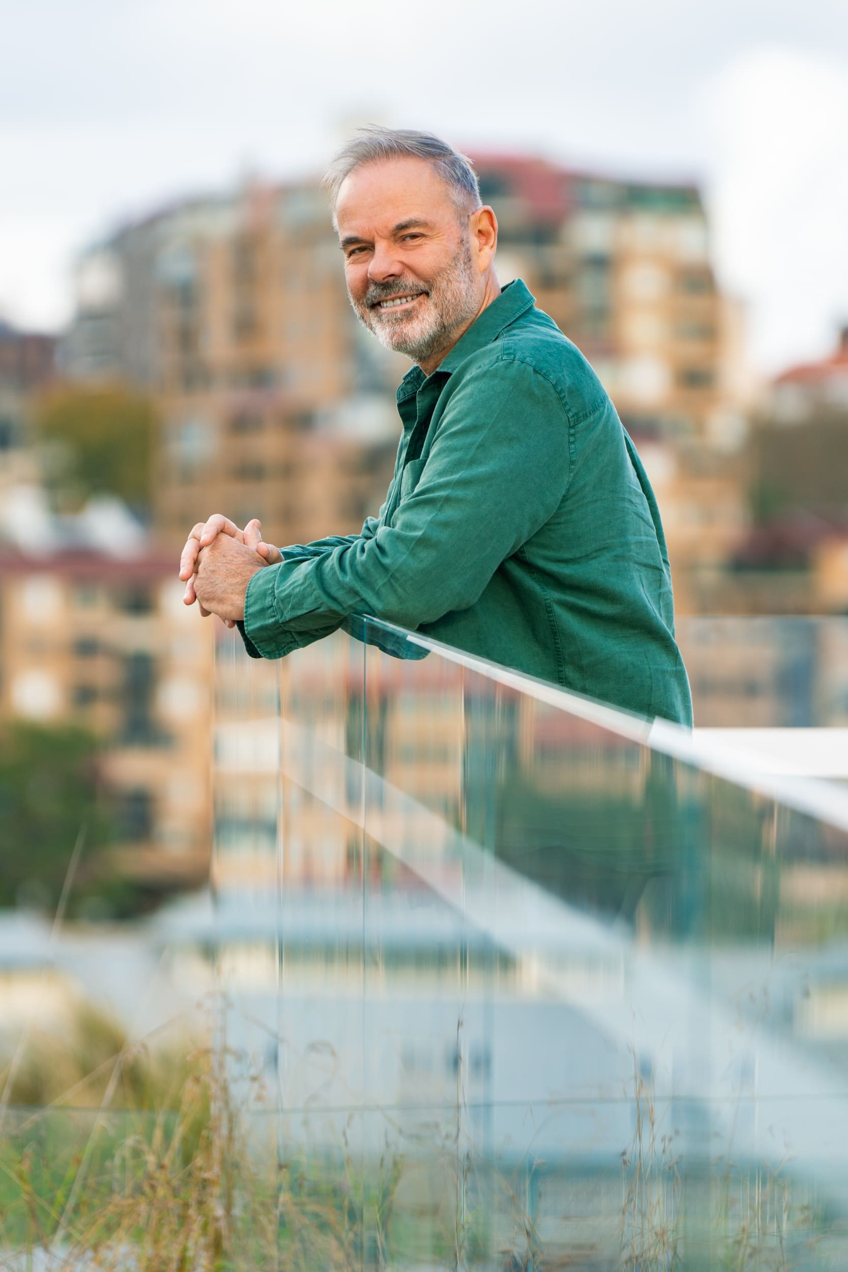 Ext: Journalist wearing a green shirt having his personal photoshoot with Branding photographer Georgie Greene in Sydney NSW