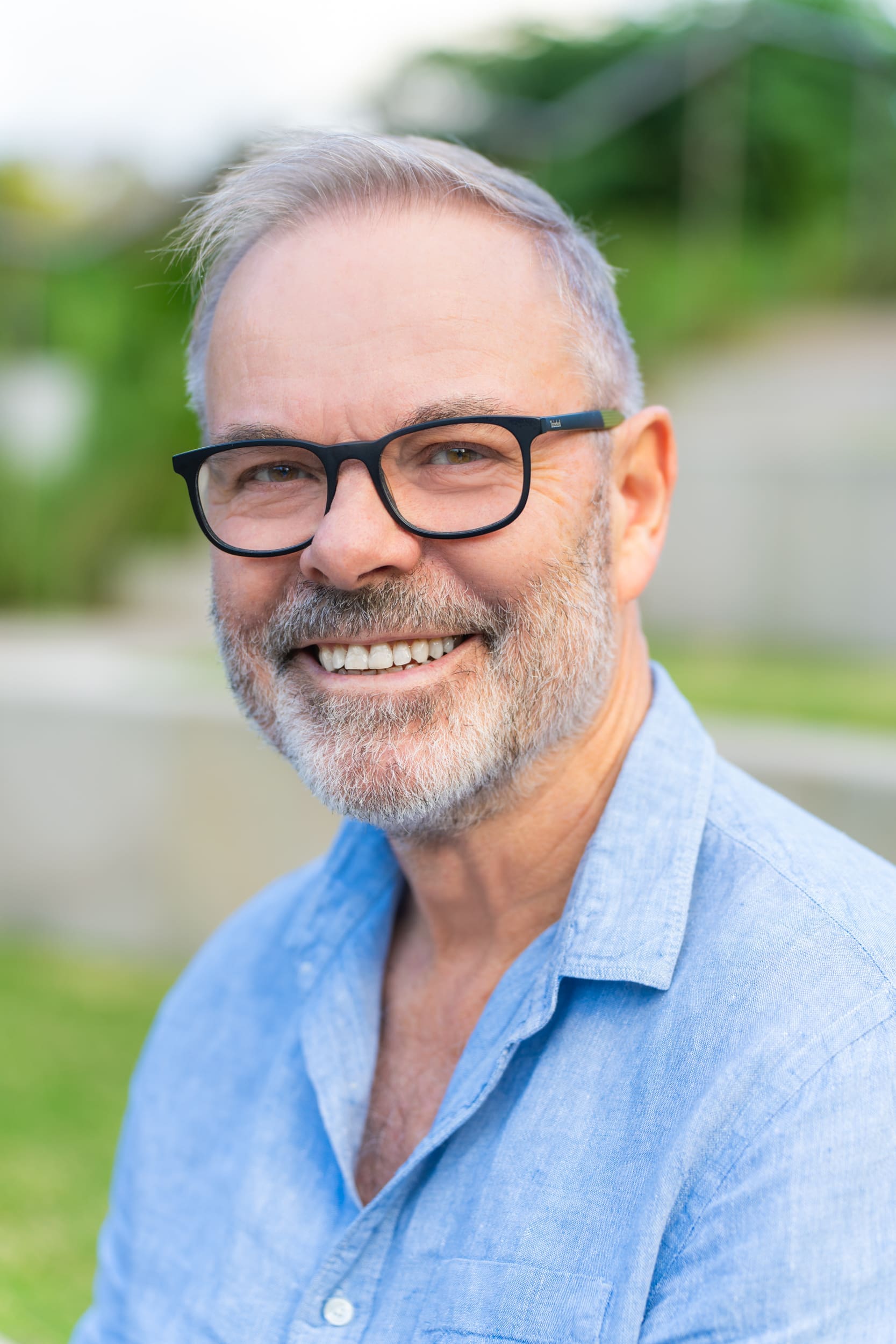 Ext: Journalist wearing a blue shirt having portrait shots taken by personal branding photographer Georgie Greene in Sydney NSW