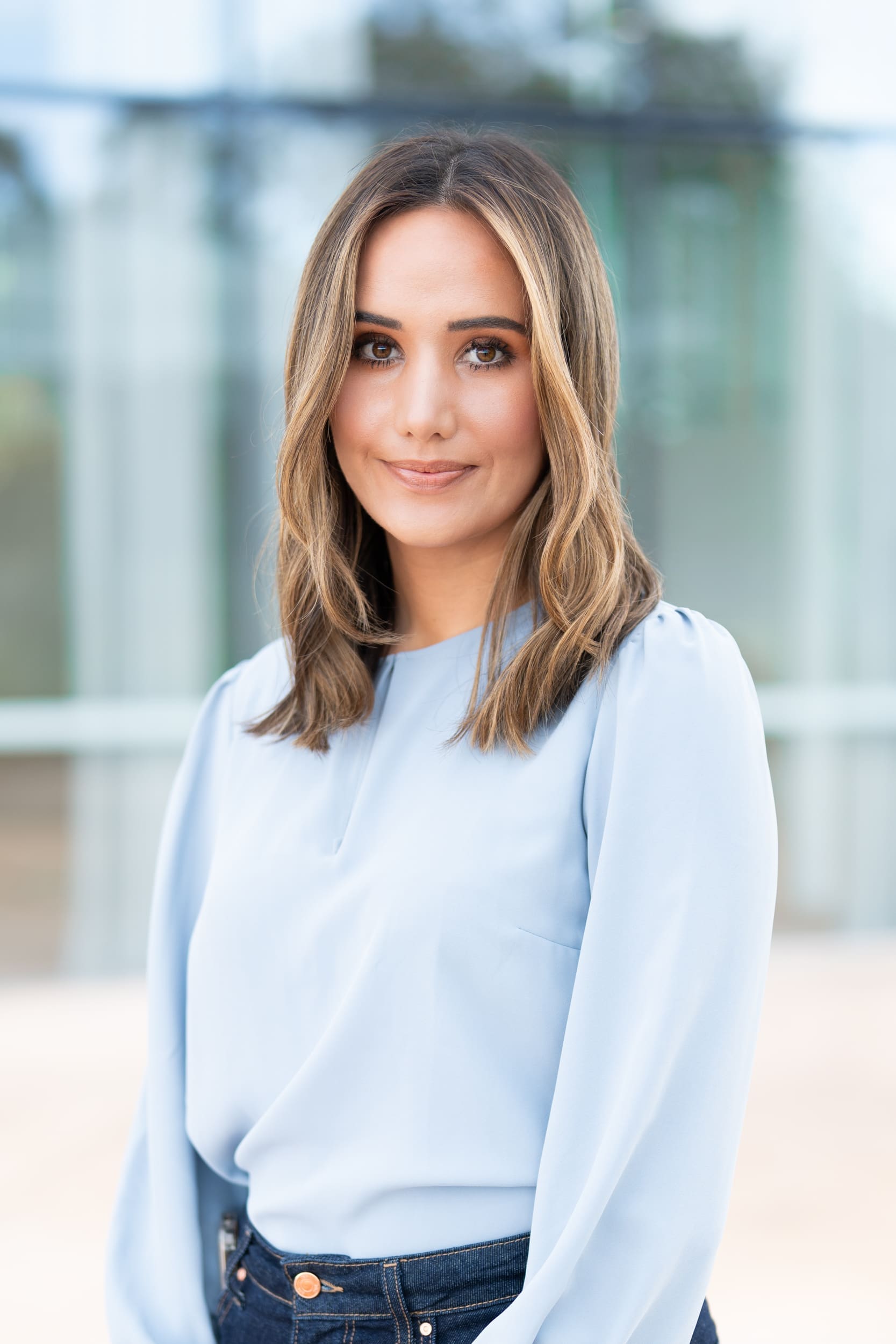Young blonde journalist wearing a blue top having her headshot taken by Sydney portrait photographer Georgie Greene