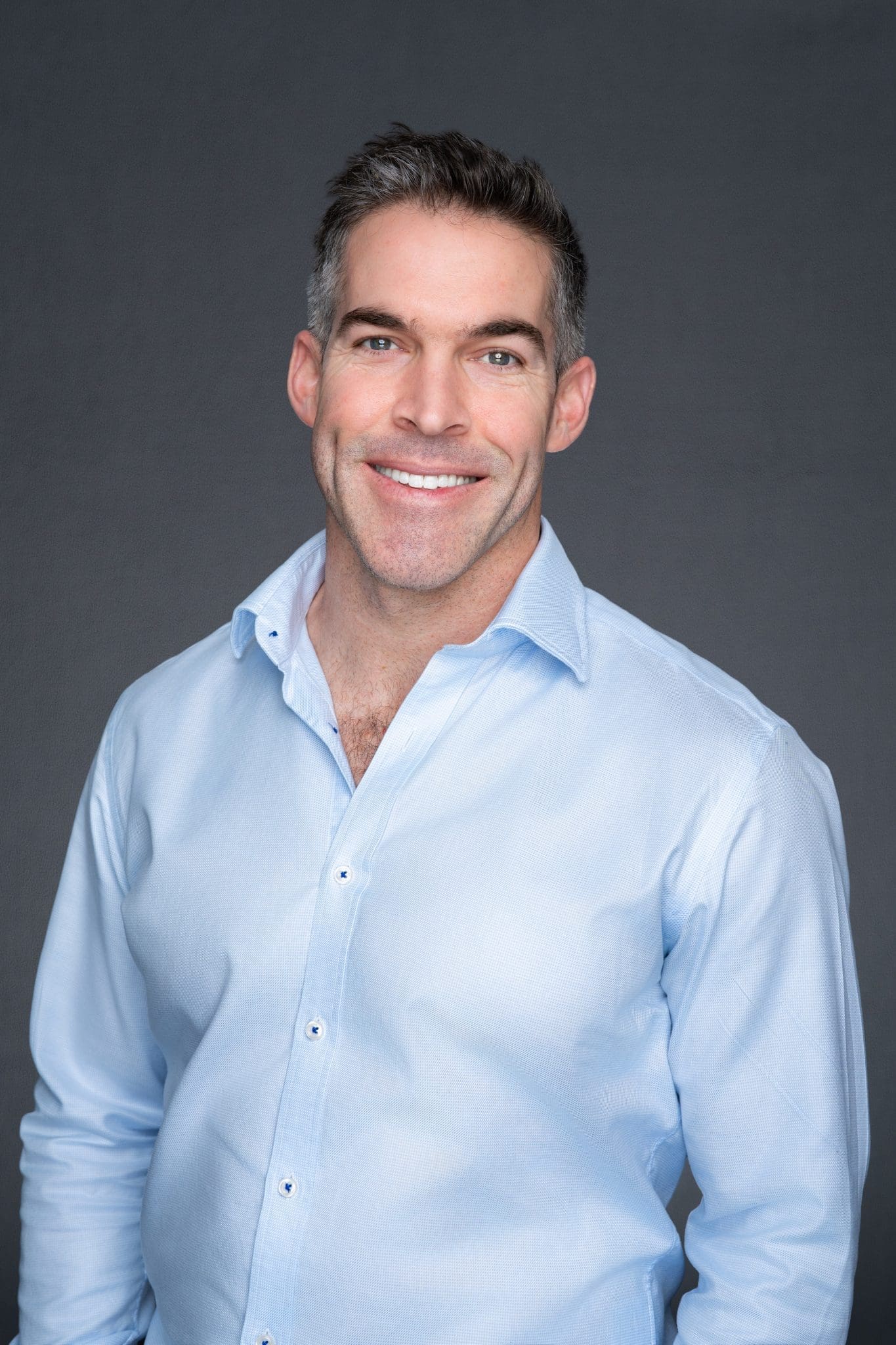 Man wearing a blue shirt having his headshot take by Georgie Greene a Sydney professional headshot photographer