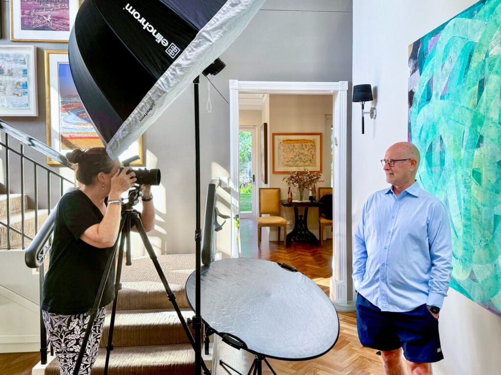 Georgie Greene Sydney headshot photographer taking a headshot in a Sydney home