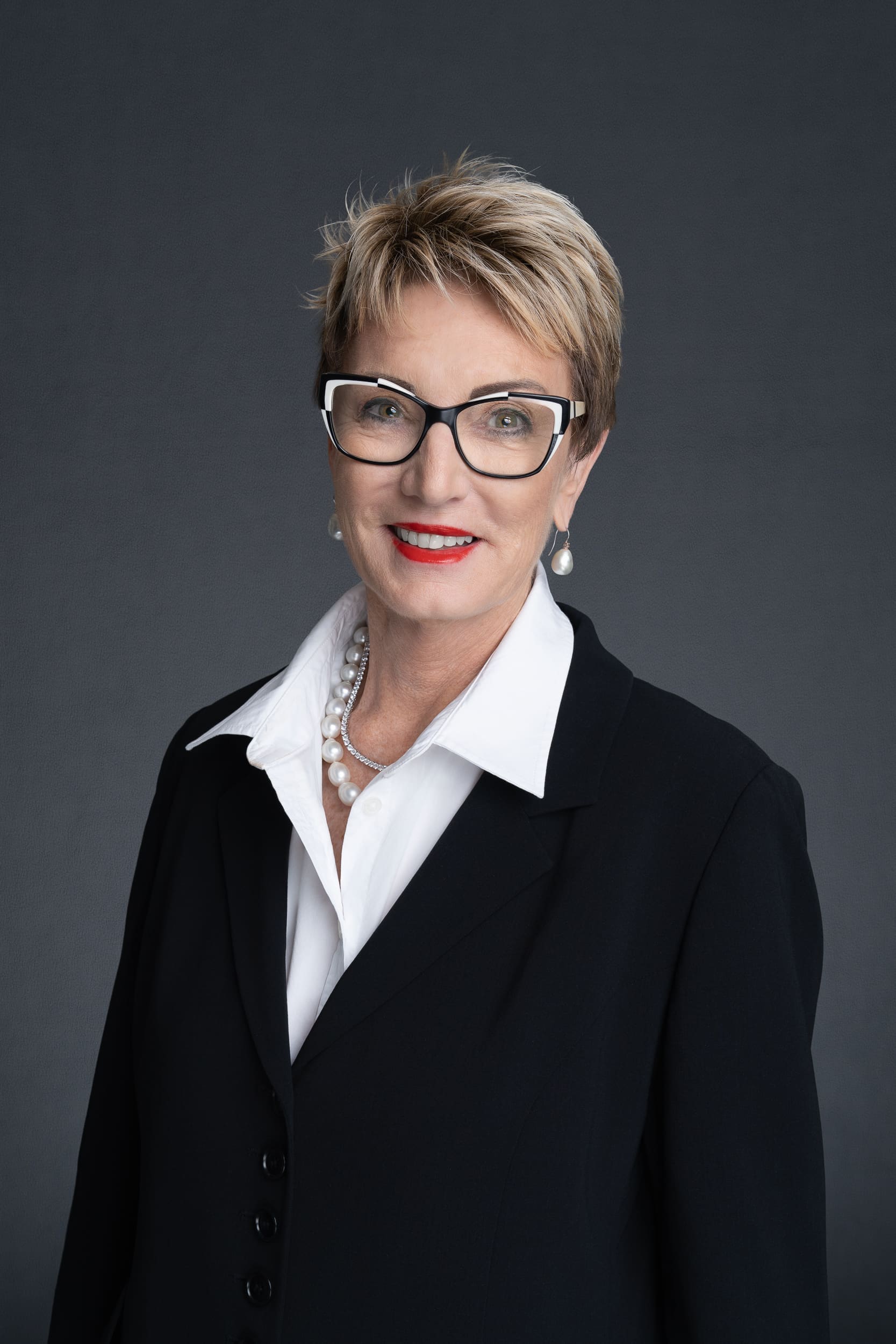 Female Therapist in a black jacket and white shirt having her headshot taken by headshot photographer Georgie Greene