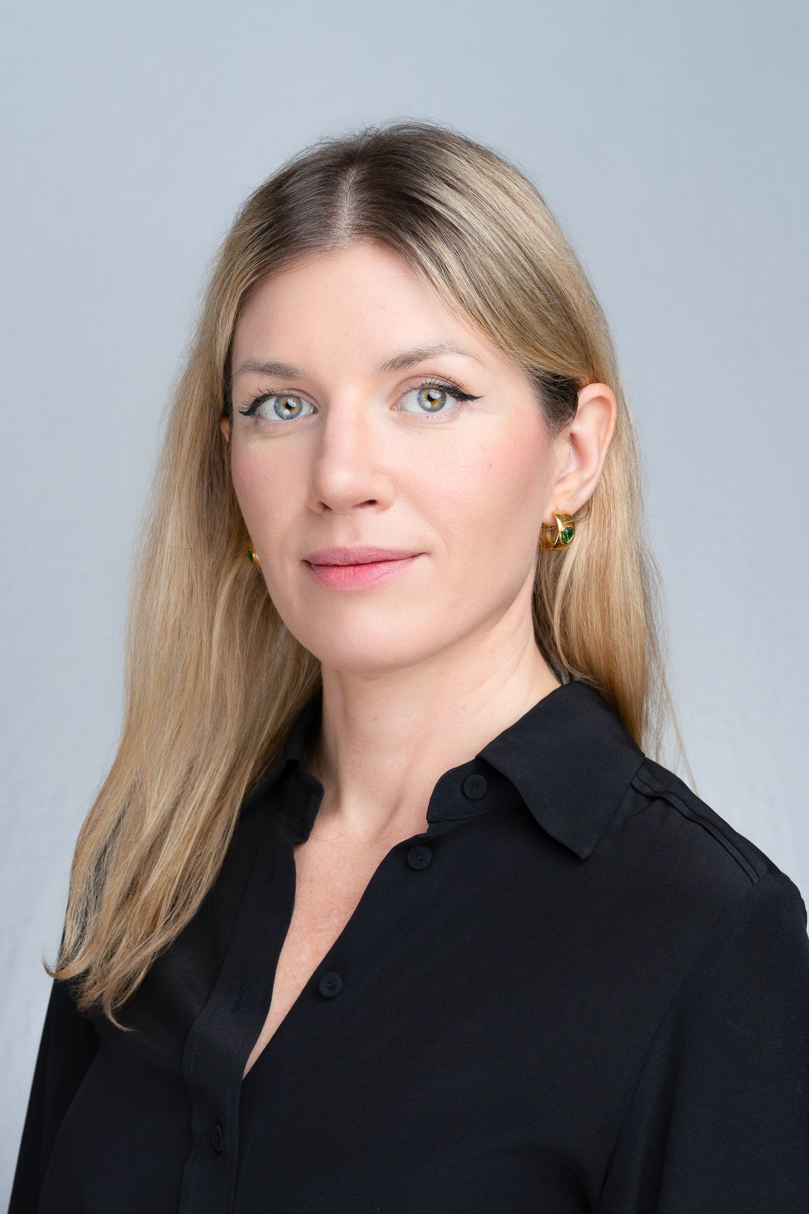 Young woman with blonde hair in a black shirt having her headshot taken by Sydney professional photographer Georgie Greene