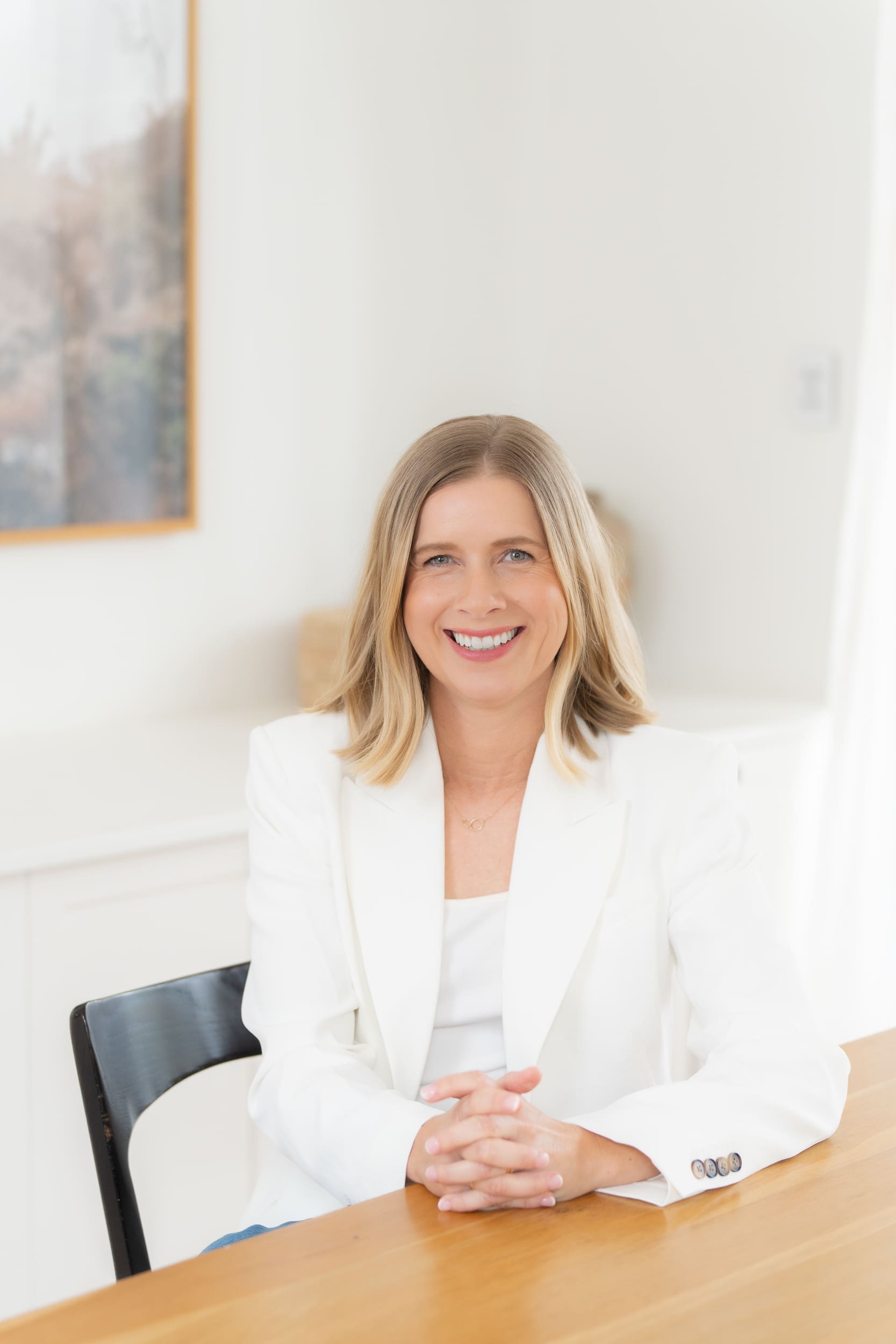 Woman in a white jacket having her personal branding photo taken by Sydney personal branding photographer Georgie Greene